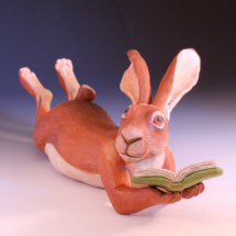 Reading Hare, stoneware and coloored pencils, 8h x 7w x 17d in., 2024